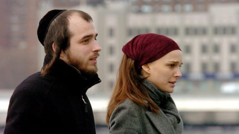 Portman and her fiancee standing outside 