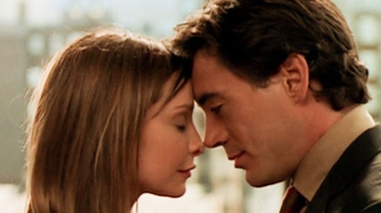 Calista Flockhart as Ally McBeal and Robert Downey, Jr as Larry Paul embracing