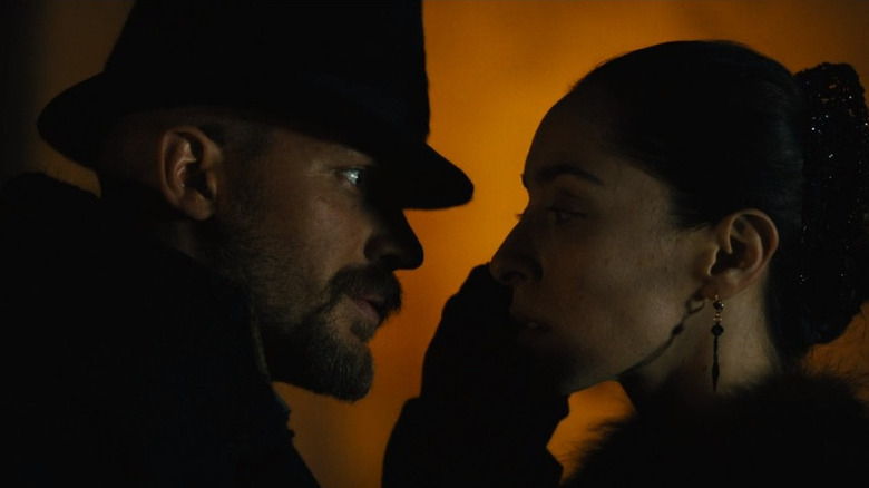 Tom Hardy and Oona Chaplin look intent