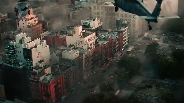 Helicopter flying over destroyed city