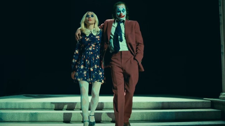 Harley Quinn and Joker walking downstairs 