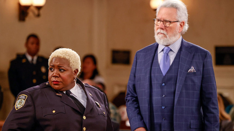 Lacretta and John Larroquette looking serious