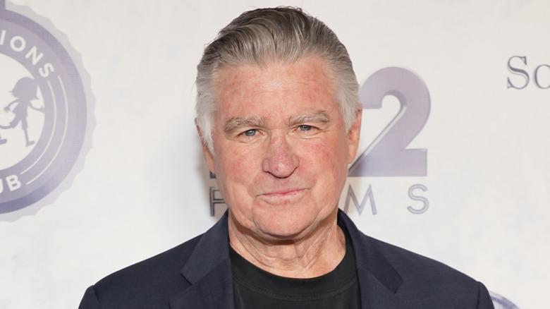 Treat Williams smirking