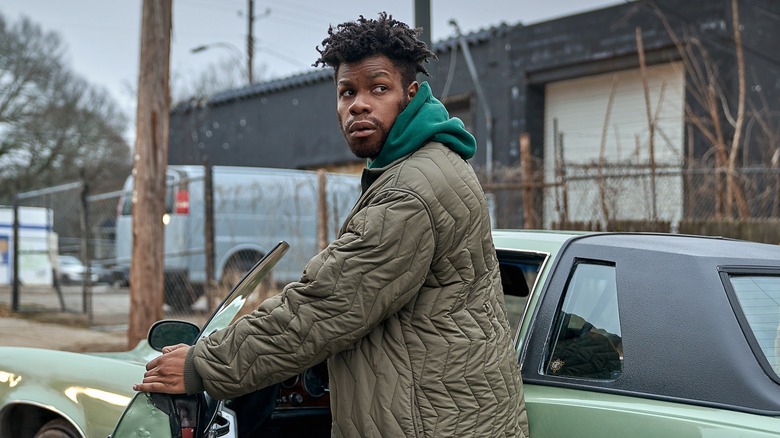 Fontaine standing by his car