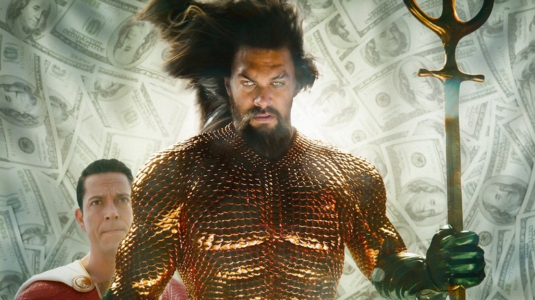 Aquaman holding trident, Shazam sad in background