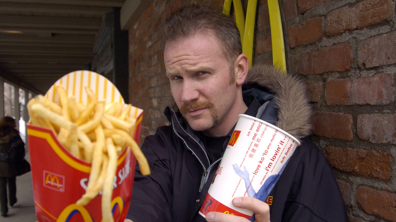 Morgan Spurlock holding McDonalds