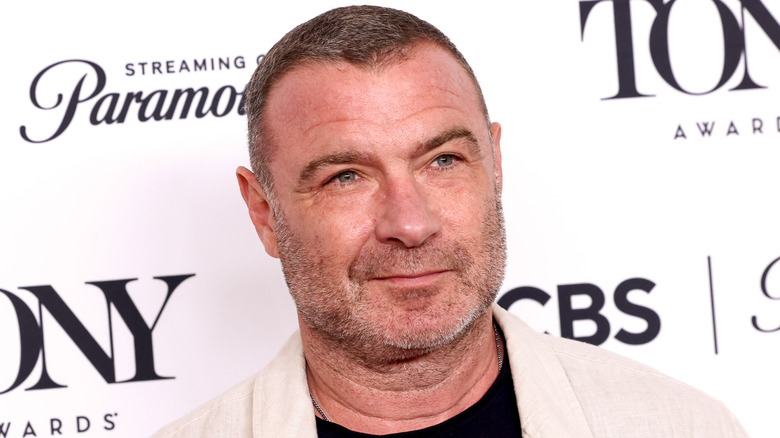 Liev Schreiber smirking