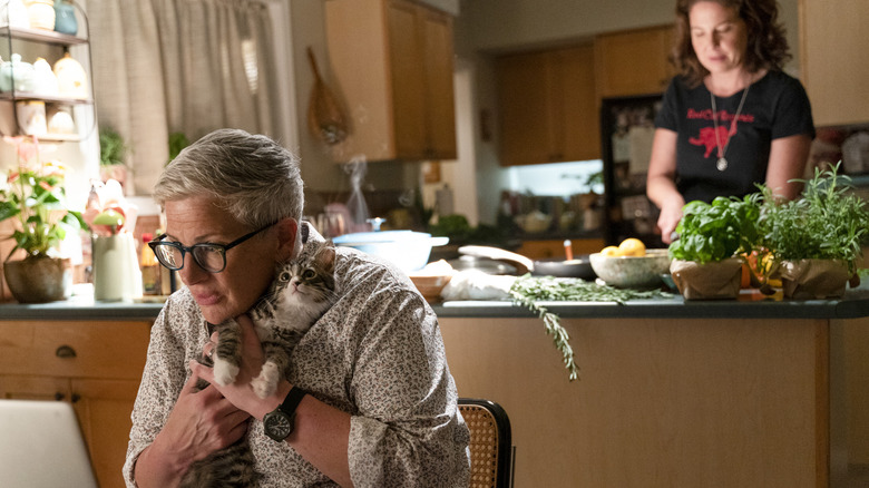 Teddi, Velma, and cats in kitchen