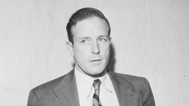 Lawrence Tierney scowls