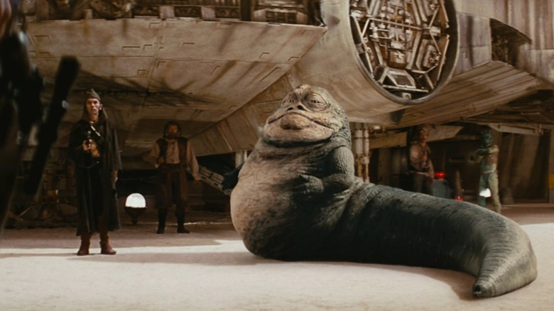 Jabba standing near Millennium Falcon