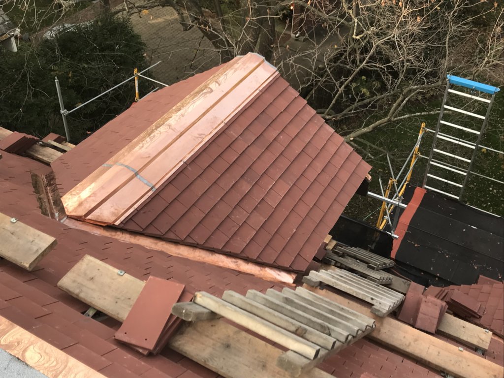   Roofer installs Tile for Dormer