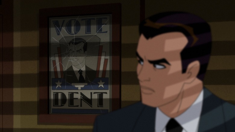 Harvey Dent glaring at campaign poster