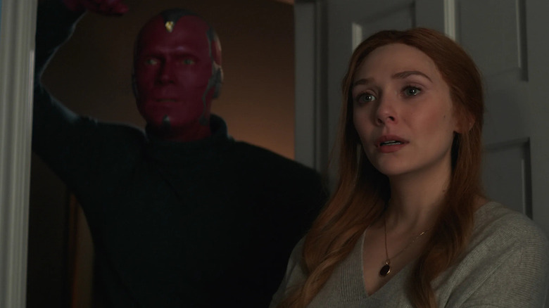 Vision and Wanda standing together