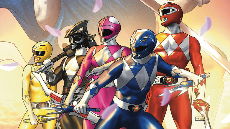 Power Rangers team with weapons