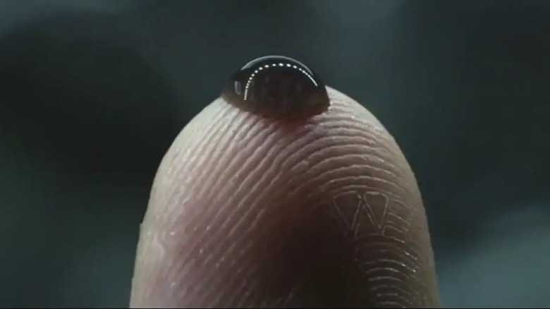 Black goo on fingertip